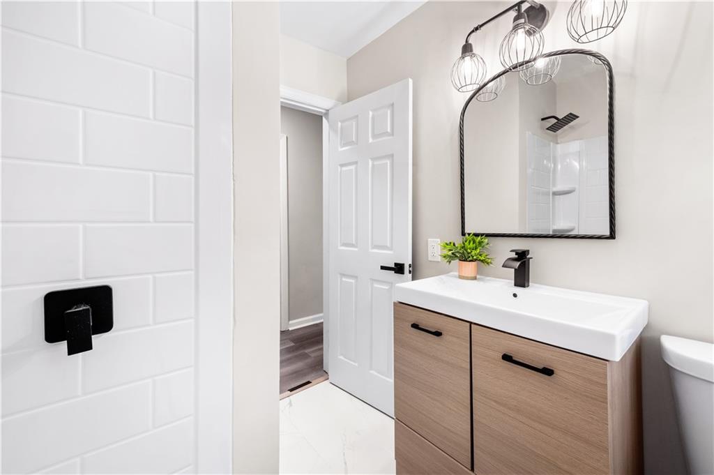 2773 Pasco Lane Southeast Atlanta, GA 30316 - Photo 11 of 40 a bathroom with a sink and a mirror