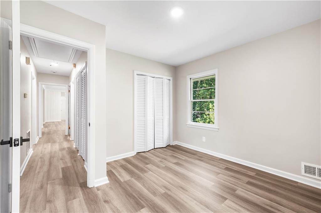 2773 Pasco Lane Southeast Atlanta, GA 30316 - Photo 18 of 40 a view of a room with a wooden floor and a bathroom