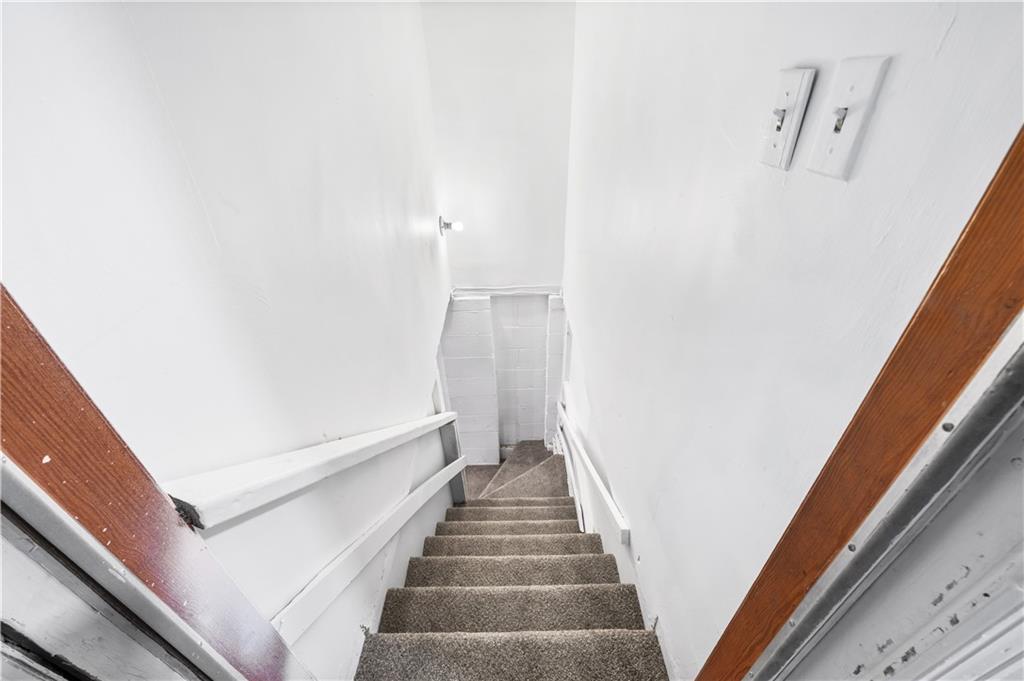 2773 Pasco Lane Southeast Atlanta, GA 30316 - Photo 20 of 40 a view of a hallway with wooden floor and stairs