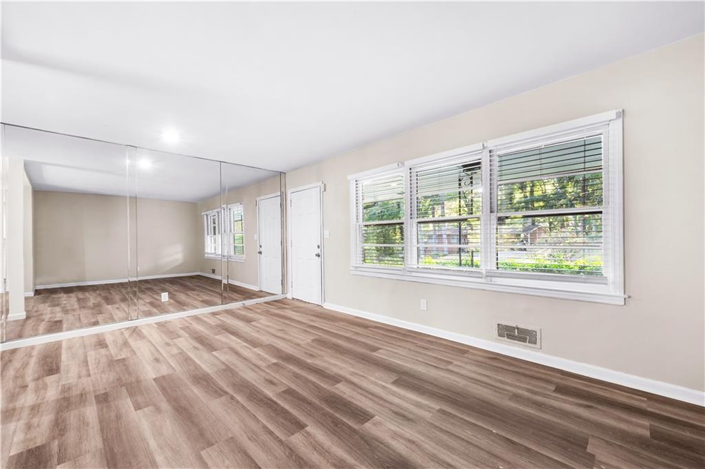 2773 Pasco Lane Southeast Atlanta, GA 30316 - Photo 5 of 40 a view of empty room with wooden floor and fan