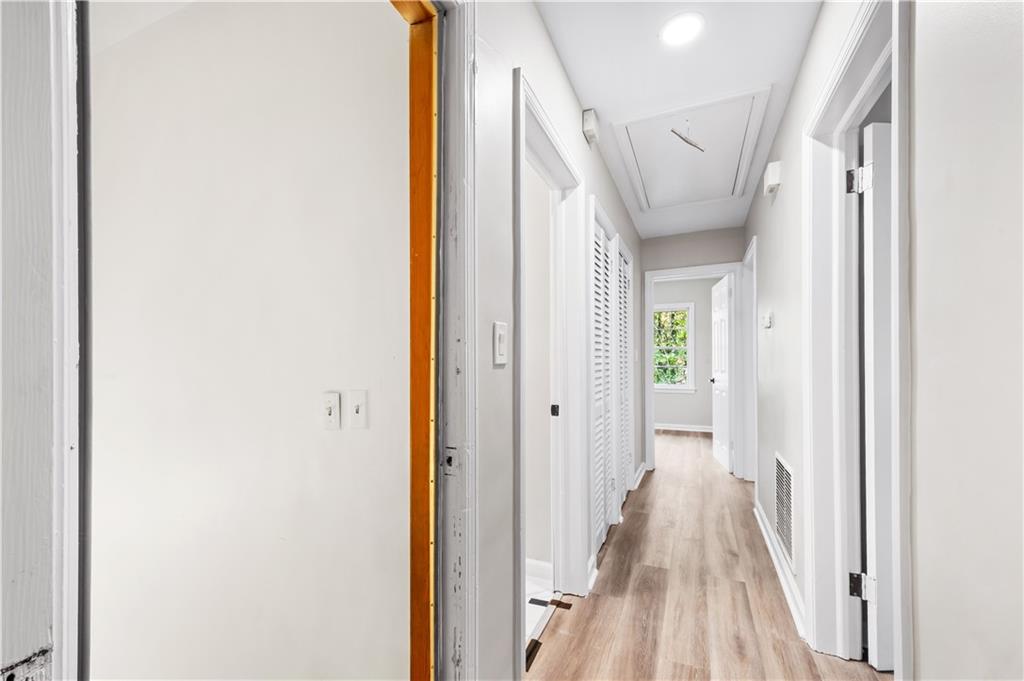 2773 Pasco Lane Southeast Atlanta, GA 30316 - Photo 9 of 40 a view of a hallway with wooden floor