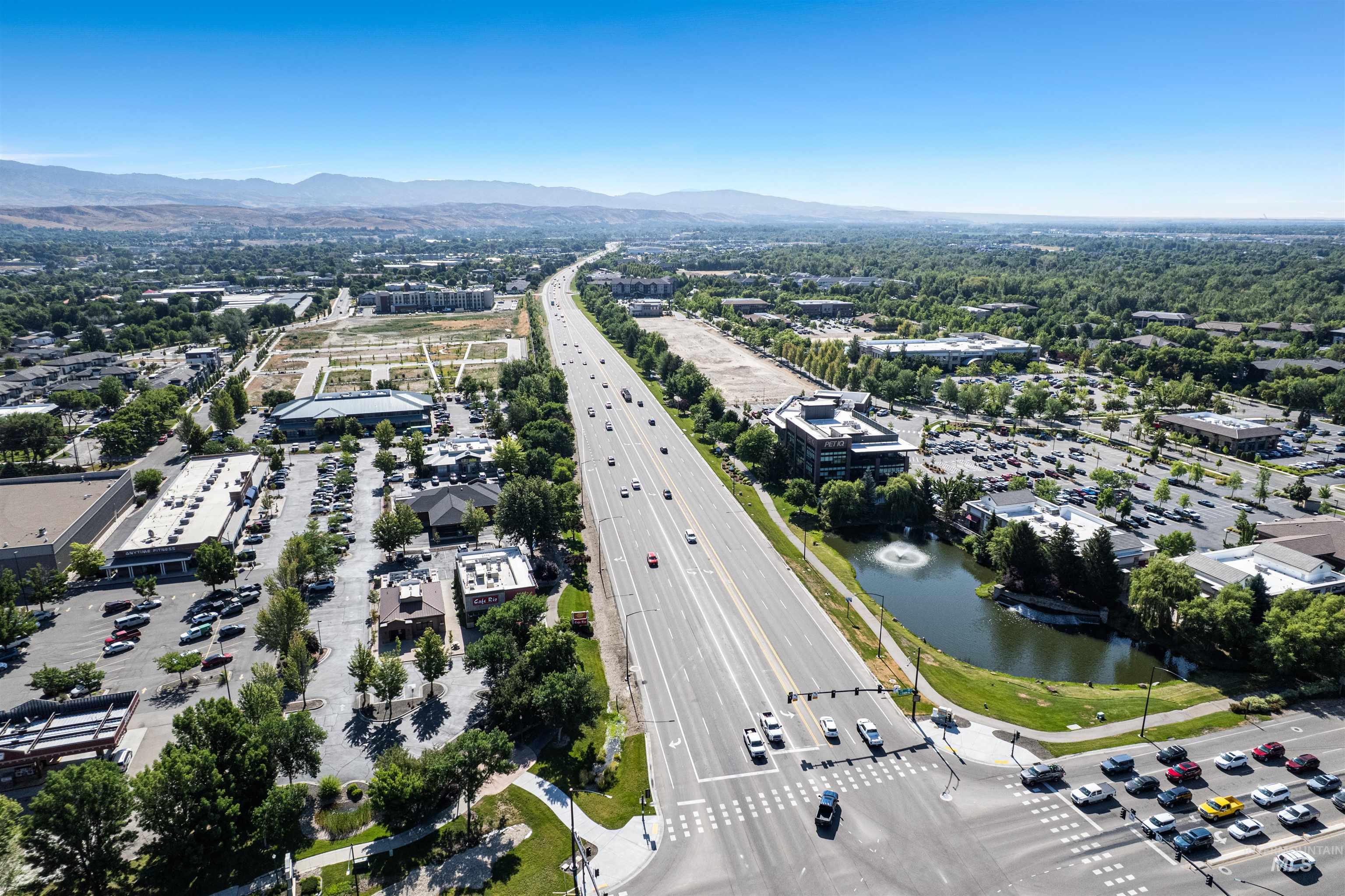 348 North Eagle Road Eagle, ID 83616 - Photo 30 of 31 Drone / aerial view of a highway and a water and mountain view