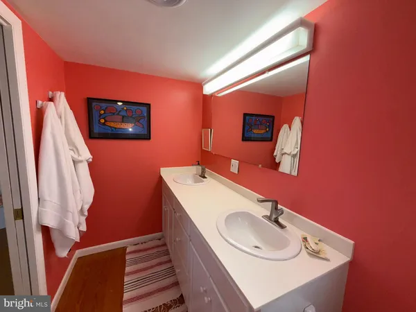 a kitchen with kitchen island a stove a sink and a refrigerator