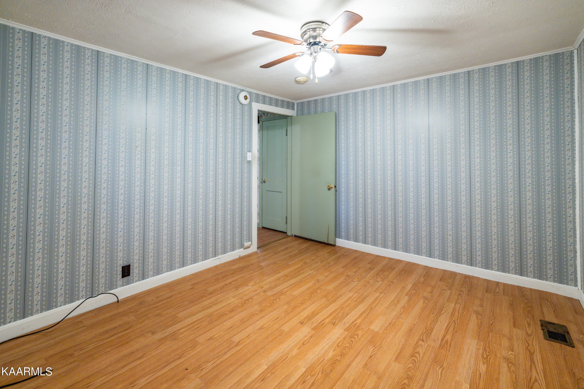 372 Raccoon Valley Road, Unit 1 Maynardville, TN 37807 - Photo 14 of 42 a view of a room with a wooden floor and a ceiling fan