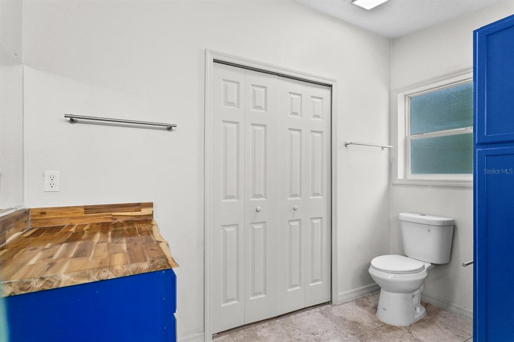 4793 Sunset Road St. Cloud, FL 34771 - Photo 19 of 28 a bathroom with a toilet