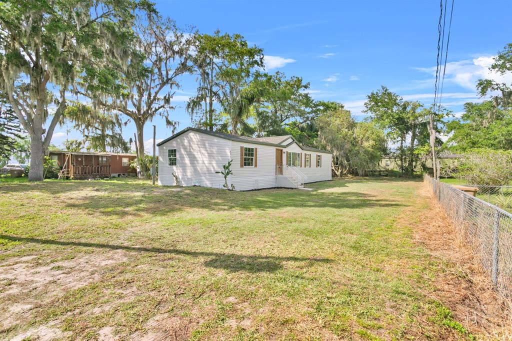 4793 Sunset Road St. Cloud, FL 34771 - Photo 25 of 28 a house view with swimming pool in front of house