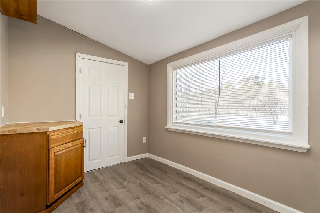 121 Short Ridge Road Albrightsville, PA 18210 - Photo 22 of 35 A wide window illuminates the versatile space with durable wood-look flooring and clean neutral walls.