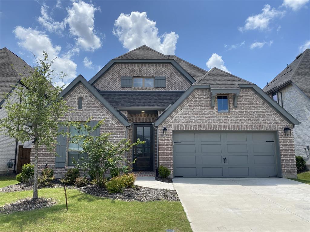 1937 Halkin Road Celina, TX 75009 - Photo 1 of 20 Brick facade featuring dark grey trim and shutters