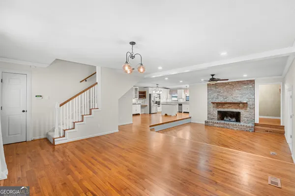 a view of a room with a ceiling fan