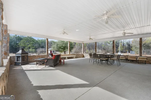a view of back yard with large trees