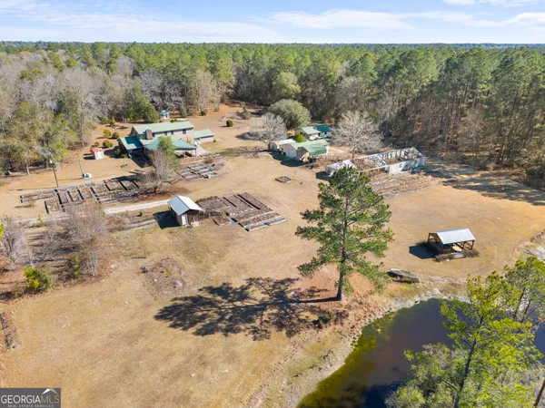 an aerial view of a house with a yard