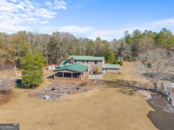 an aerial view of residential houses with outdoor space