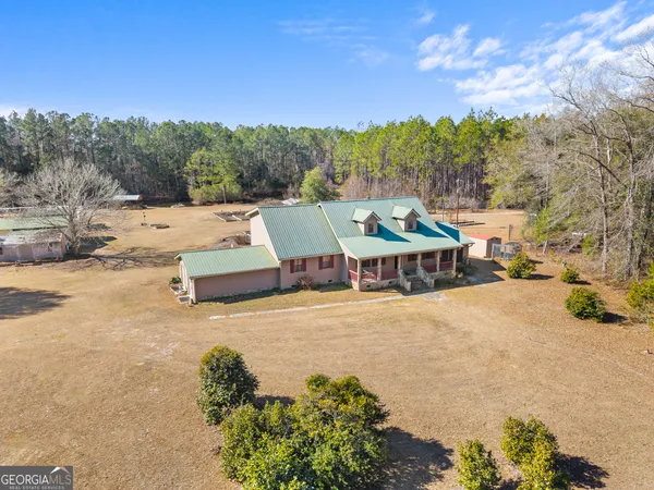an aerial view of residential houses with outdoor space