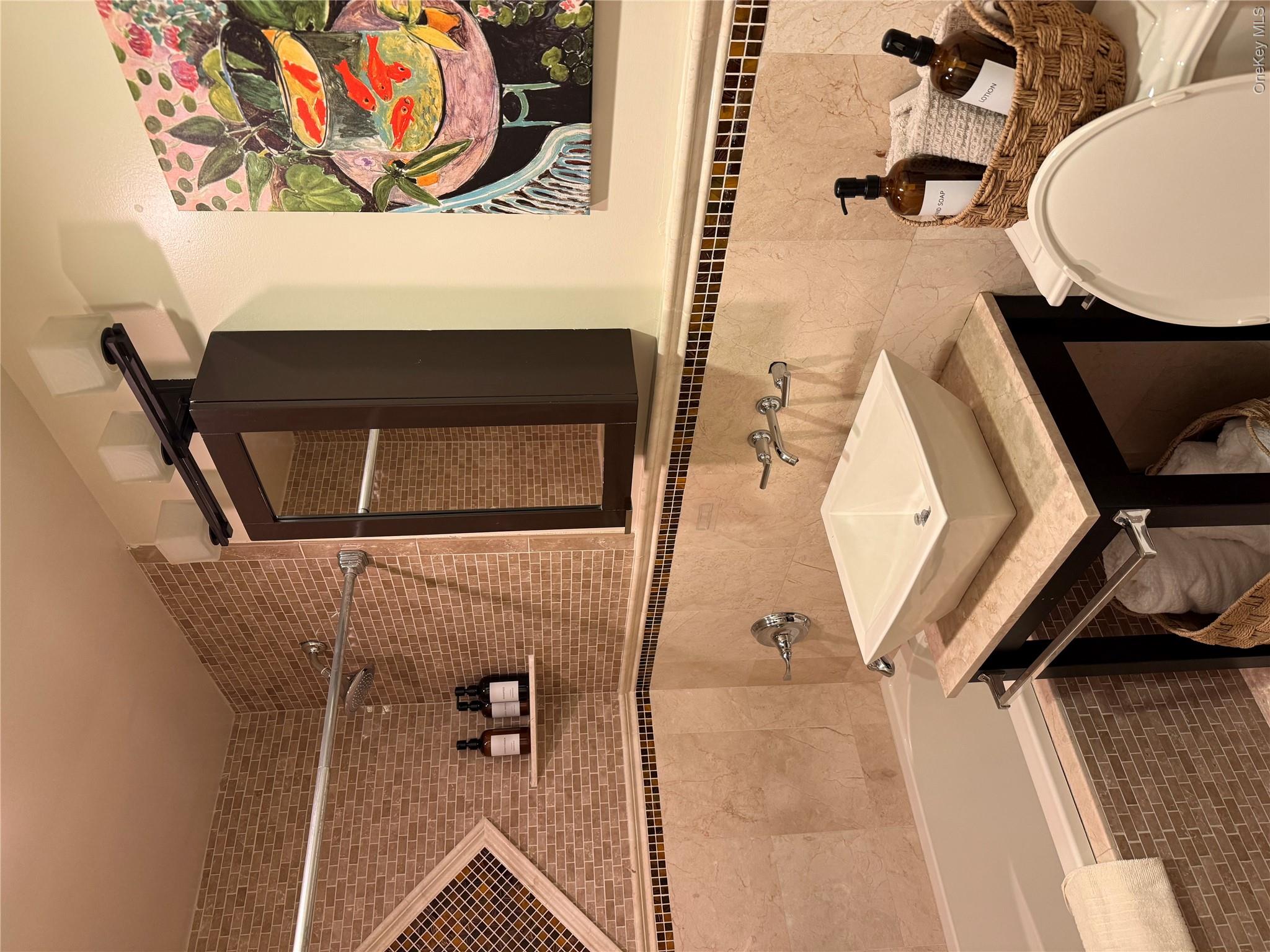 29 Wilton Road Rye Brook, NY 10573 - Photo 13 of 18 Bathroom featuring toilet, vanity, tile walls, and tiled shower / bath combo