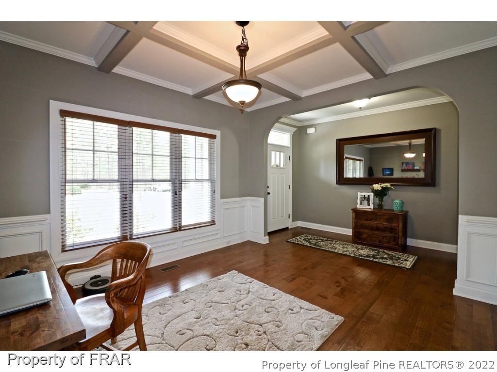 1187 Rays Bridge Road Whispering Pines, NC 28327 - Photo 3 of 35 a living room with furniture and a flat screen tv