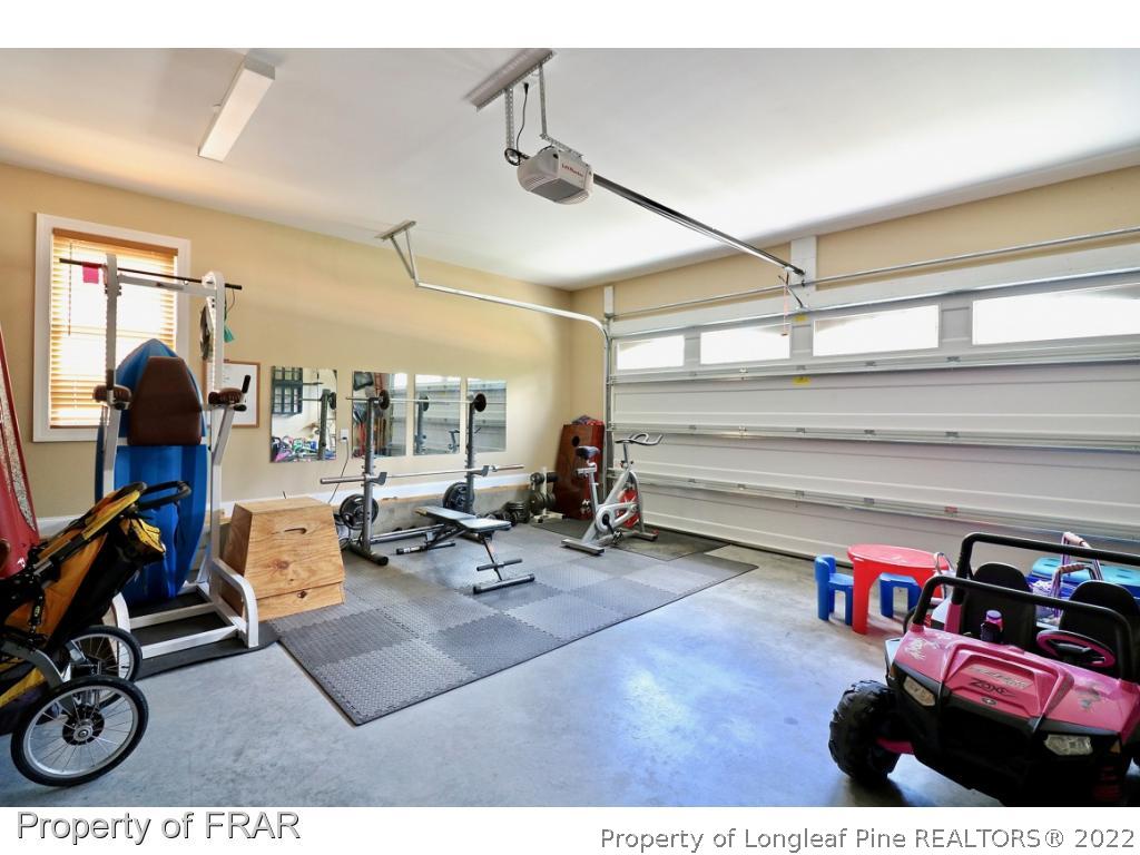 1187 Rays Bridge Road Whispering Pines, NC 28327 - Photo 33 of 35 a view of a room with gym equipment