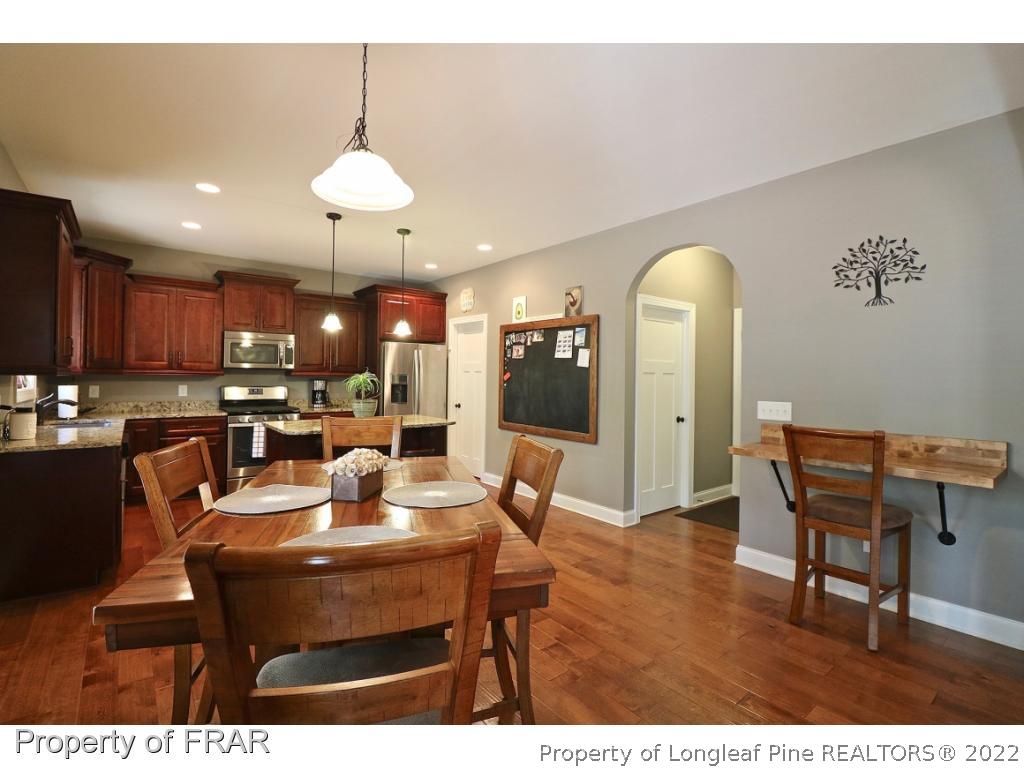 1187 Rays Bridge Road Whispering Pines, NC 28327 - Photo 5 of 35 a dining room with furniture and window