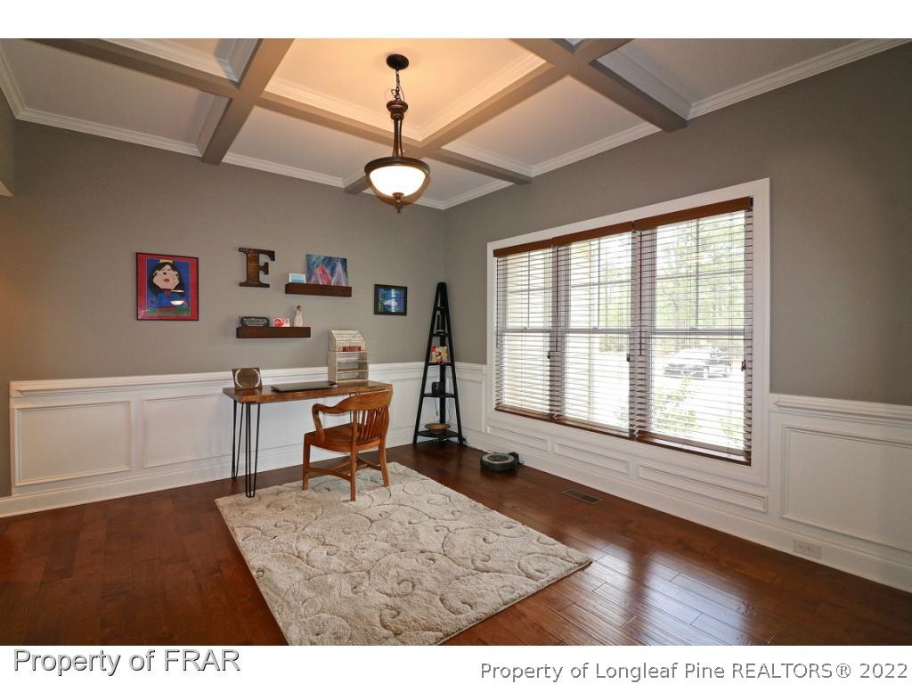 1187 Rays Bridge Road Whispering Pines, NC 28327 - Photo 10 of 35 a living room with furniture and a window