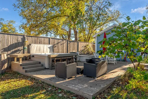 a view of a backyard with sitting area