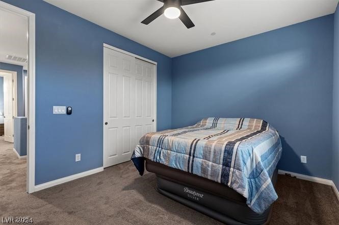 805 East Sunset Road Henderson, NV 89011 - Photo 19 of 43 Carpeted bedroom with ceiling fan and a closet