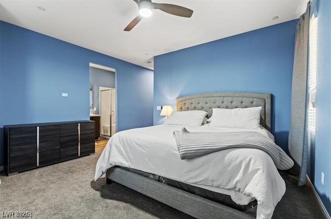 805 East Sunset Road Henderson, NV 89011 - Photo 23 of 43 Bedroom with carpet flooring, ceiling fan, and ensuite bath
