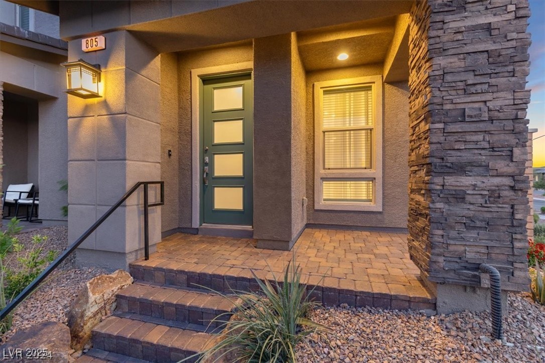 805 East Sunset Road Henderson, NV 89011 - Photo 3 of 43 Doorway to property with stucco siding