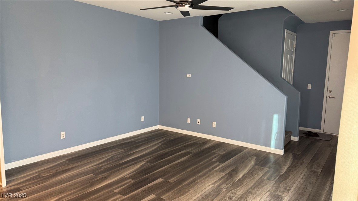 805 East Sunset Road Henderson, NV 89011 - Photo 41 of 43 Unfurnished living room with ceiling fan, dark wood finished floors, stairs, and recessed lighting