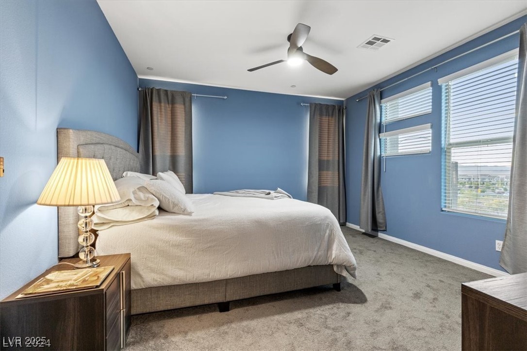 805 East Sunset Road Henderson, NV 89011 - Photo 5 of 43 Bedroom with carpet floors and ceiling fan