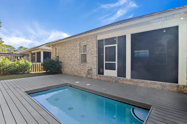 a view of a swimming pool and a yard