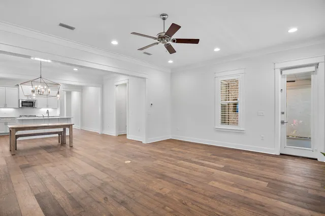 a view of a kitchen with a table and chairs