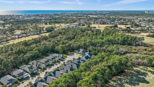 an aerial view of lake residential house with swimming pool