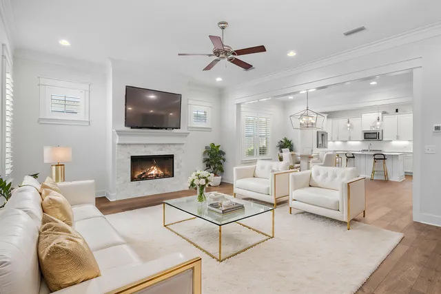 a kitchen with granite countertop white cabinets and stainless steel appliances