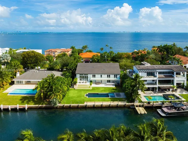 an aerial view of a house with a garden lake view