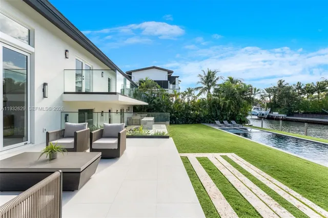 a view of a patio with swimming pool table and chairs