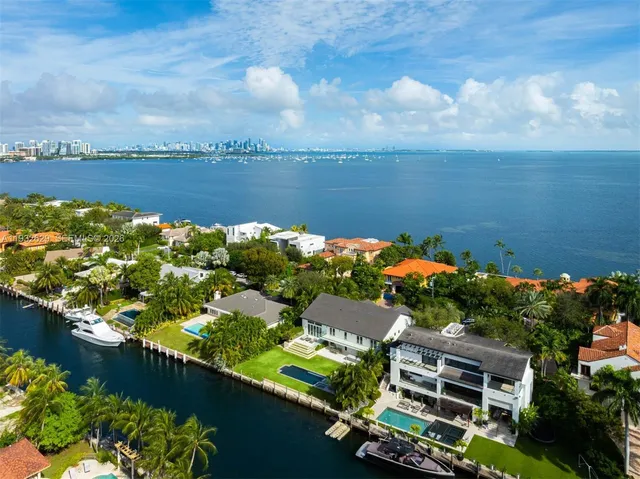 an aerial view of house with yard swimming pool and outdoor seating
