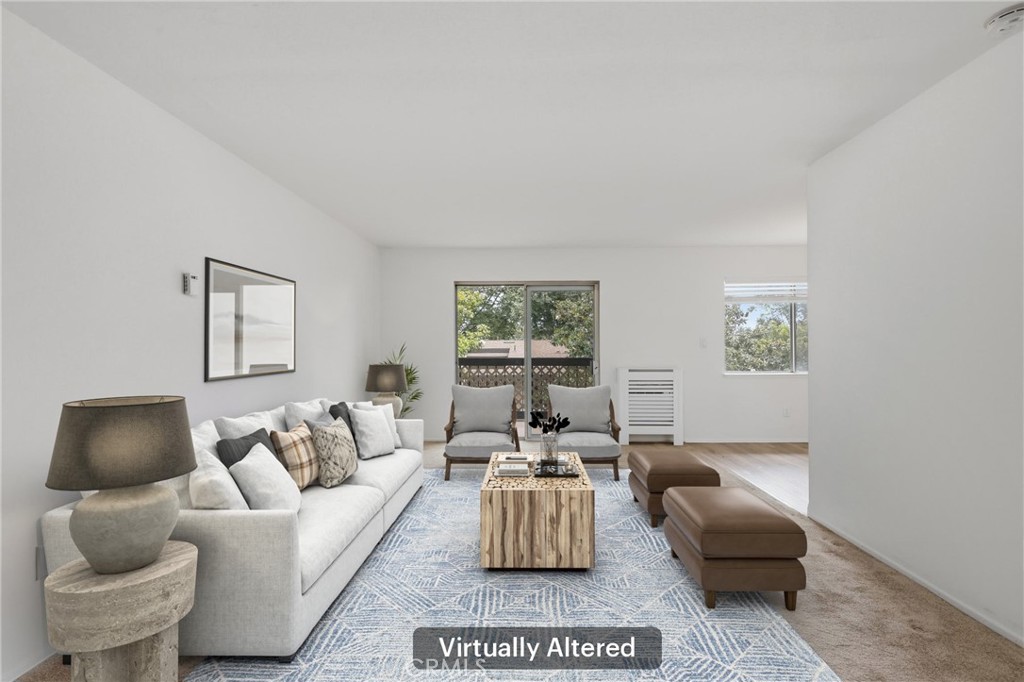12200 Montecito Road, Unit D301 Seal Beach, CA 90740 - Photo 1 of 28 a living room with furniture and a couch