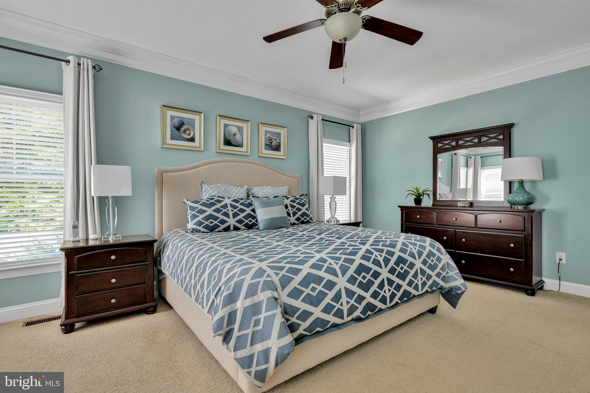 18131 Emerson Way Georgetown, DE 19947 - Photo 21 of 52 a bedroom with a bed and ceiling fan