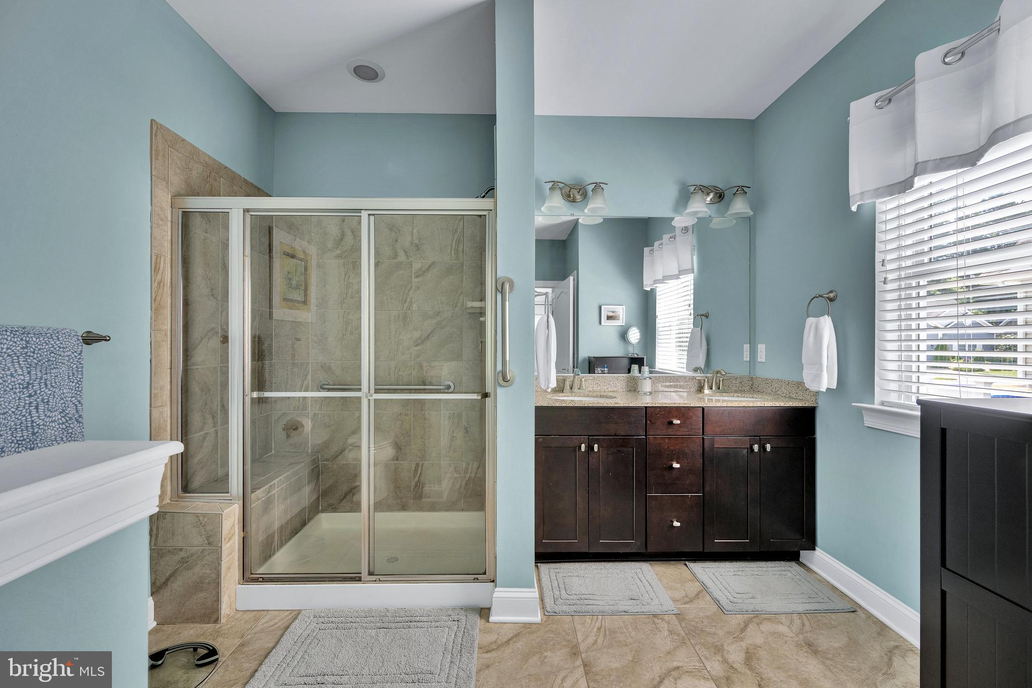 18131 Emerson Way Georgetown, DE 19947 - Photo 22 of 52 a bathroom with a sink and a mirror