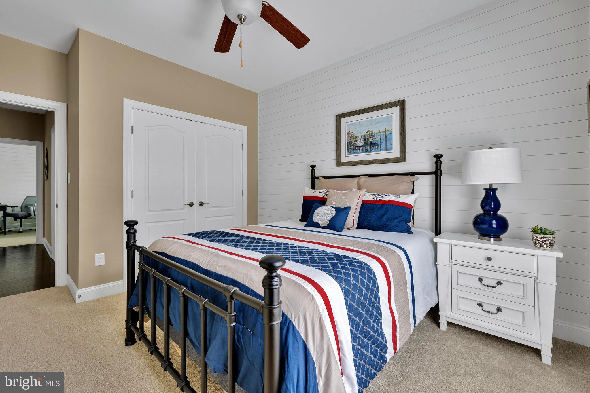 18131 Emerson Way Georgetown, DE 19947 - Photo 25 of 52 a bedroom with a bed and a chandelier