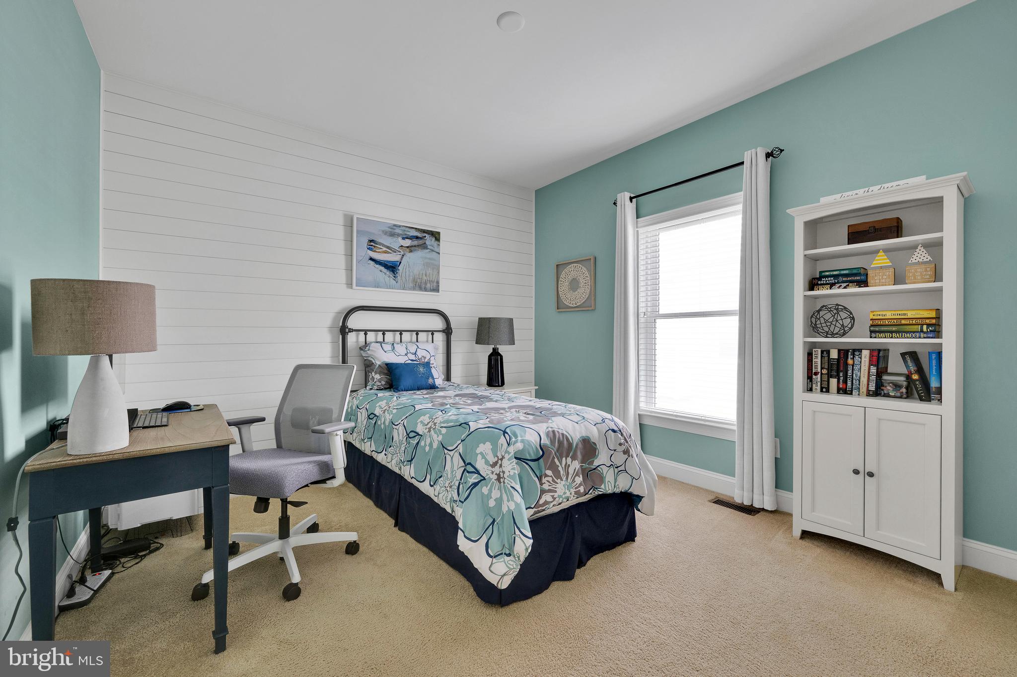 18131 Emerson Way Georgetown, DE 19947 - Photo 28 of 52 a bedroom with a bed and a table in it