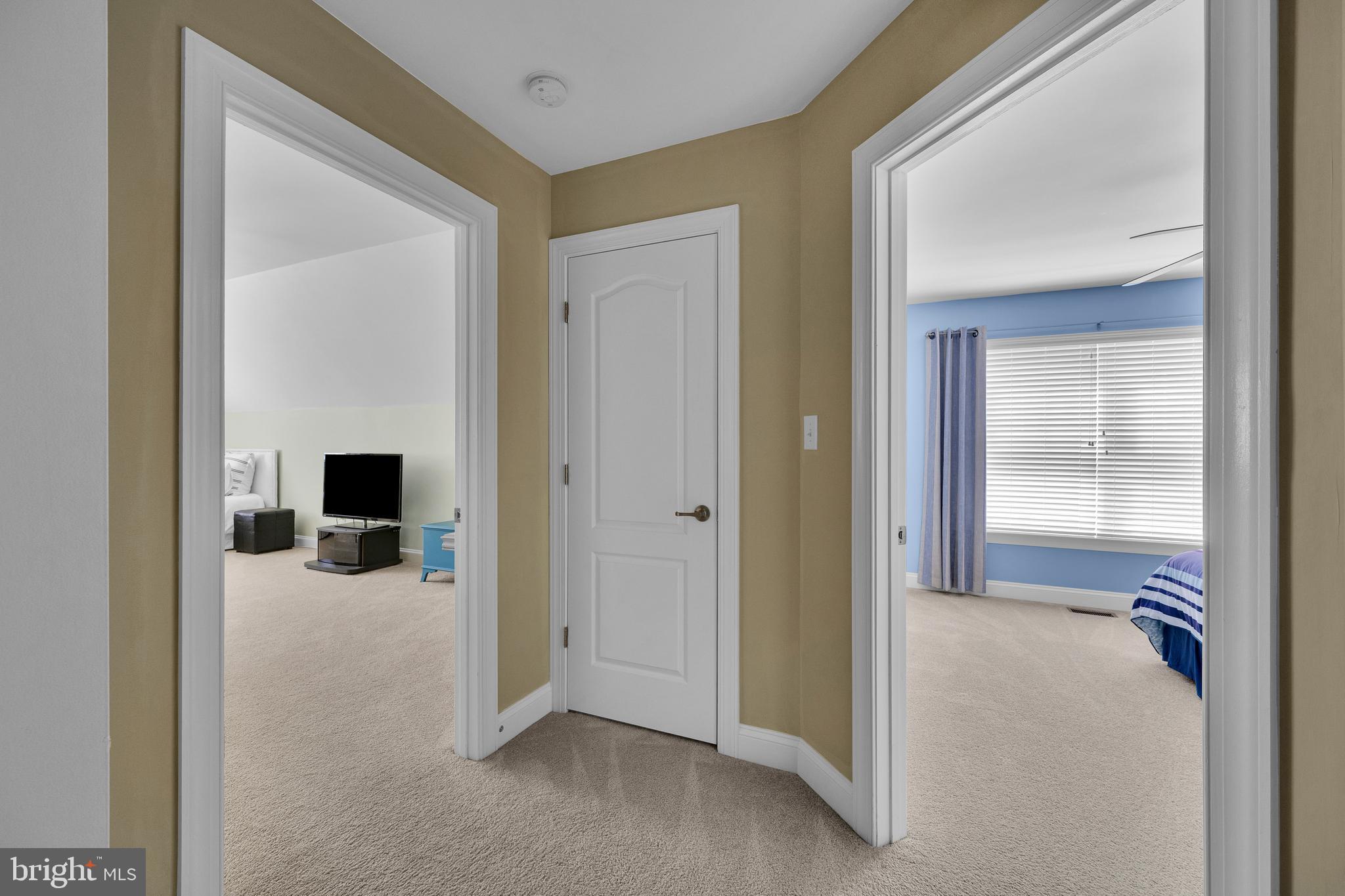 18131 Emerson Way Georgetown, DE 19947 - Photo 29 of 52 a view of a livingroom and a hallway to a livingroom and a livingroom with furniture