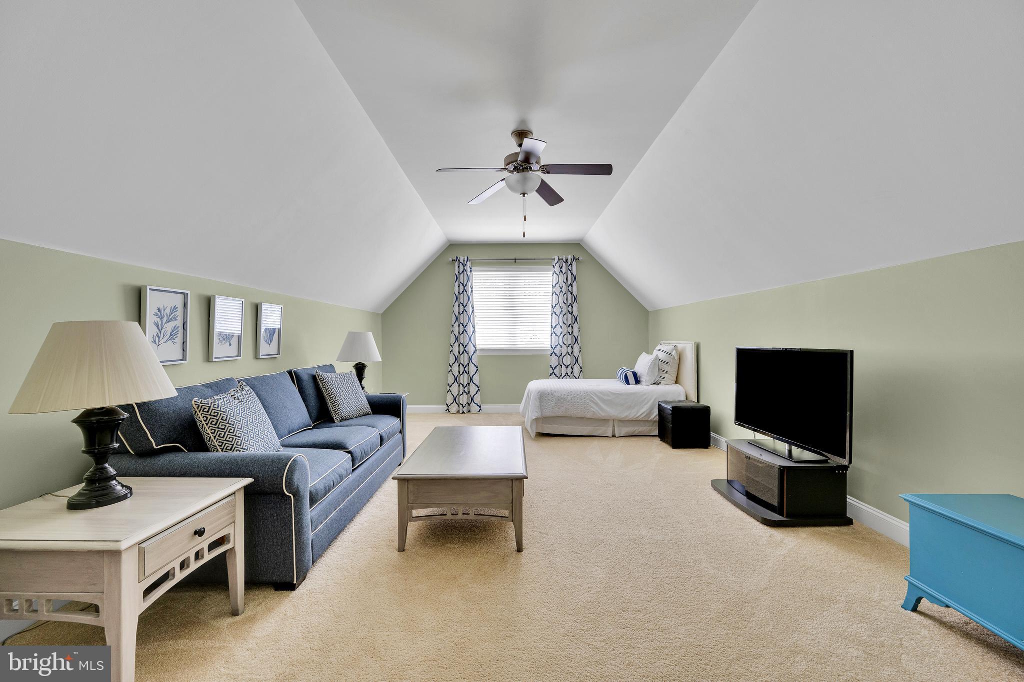 18131 Emerson Way Georgetown, DE 19947 - Photo 30 of 52 a living room with furniture and a flat screen tv