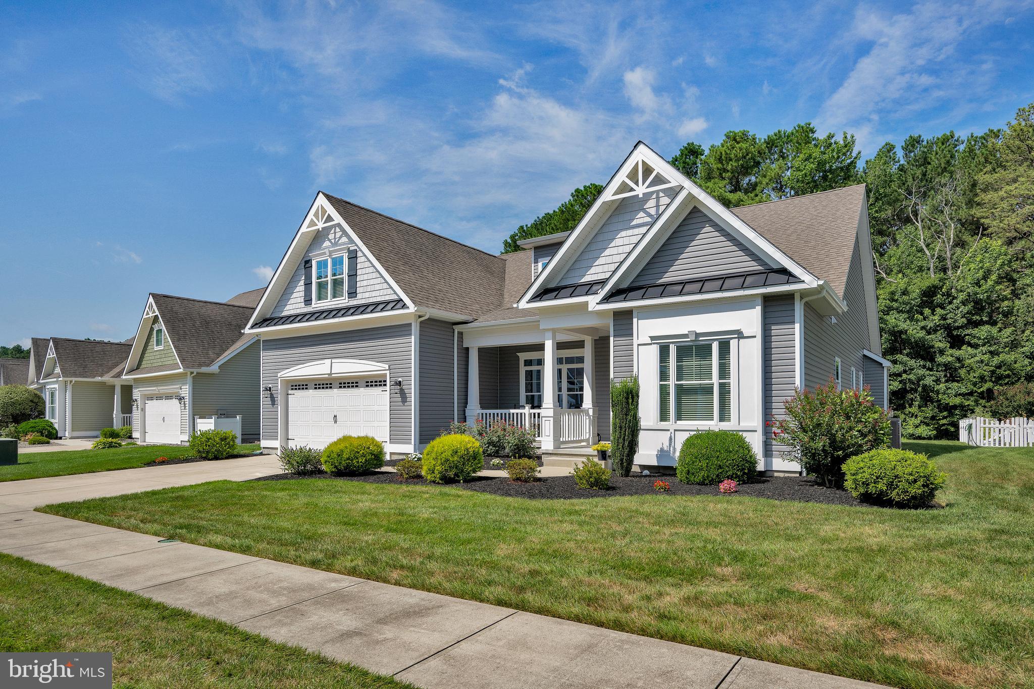 18131 Emerson Way Georgetown, DE 19947 - Photo 3 of 52 a view of a house with a yard