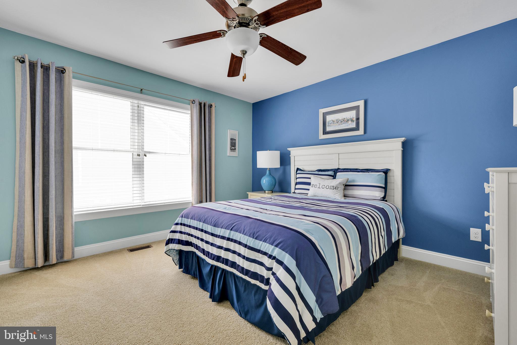 18131 Emerson Way Georgetown, DE 19947 - Photo 32 of 52 a bedroom with a bed and window