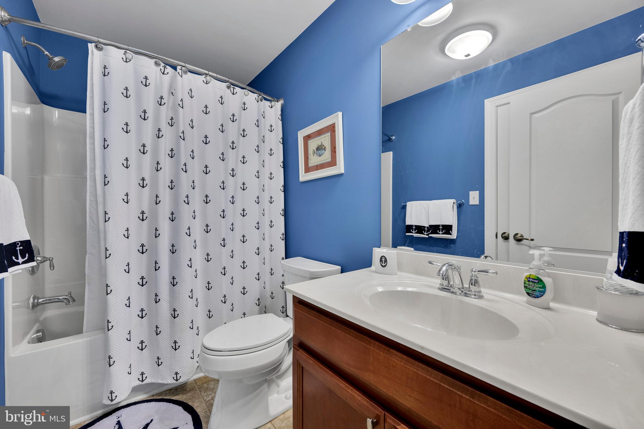 18131 Emerson Way Georgetown, DE 19947 - Photo 33 of 53 a bathroom with a sink toilet and shower