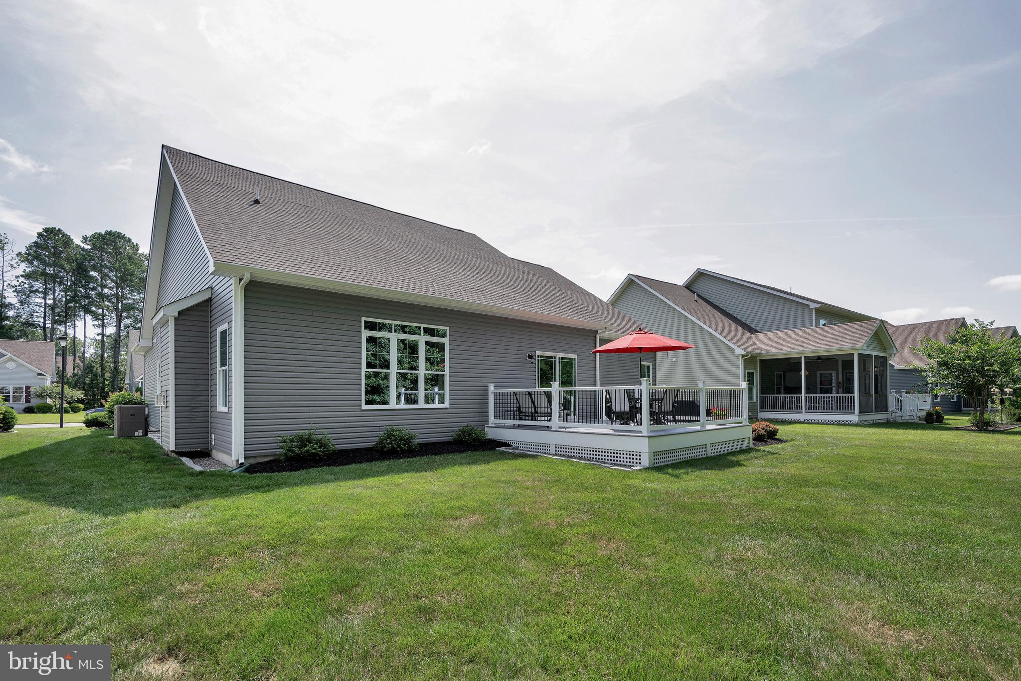 18131 Emerson Way Georgetown, DE 19947 - Photo 40 of 52 a front view of house with yard and outdoor seating