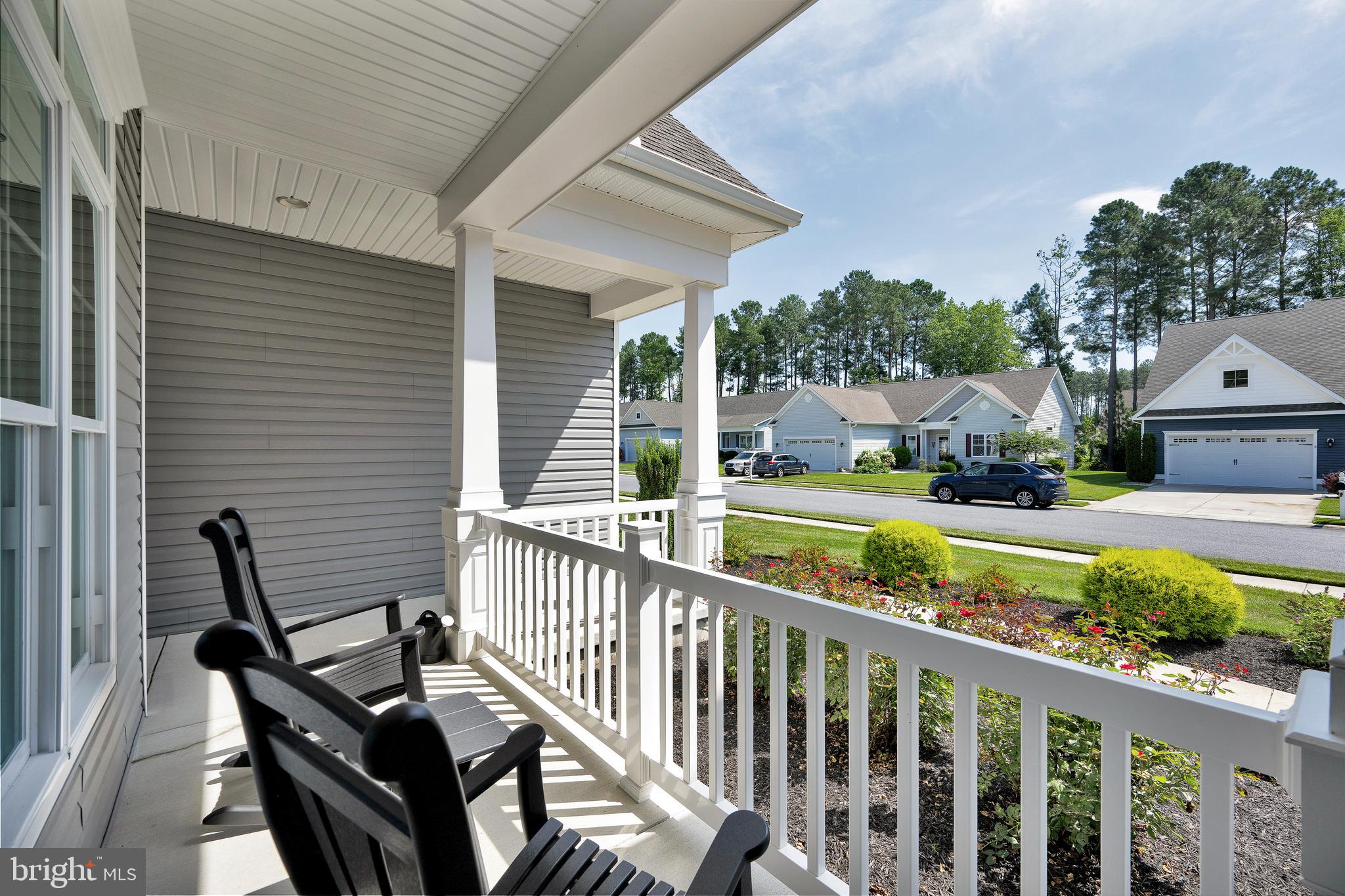 18131 Emerson Way Georgetown, DE 19947 - Photo 4 of 52 a view of balcony with wooden floor and outdoor seating
