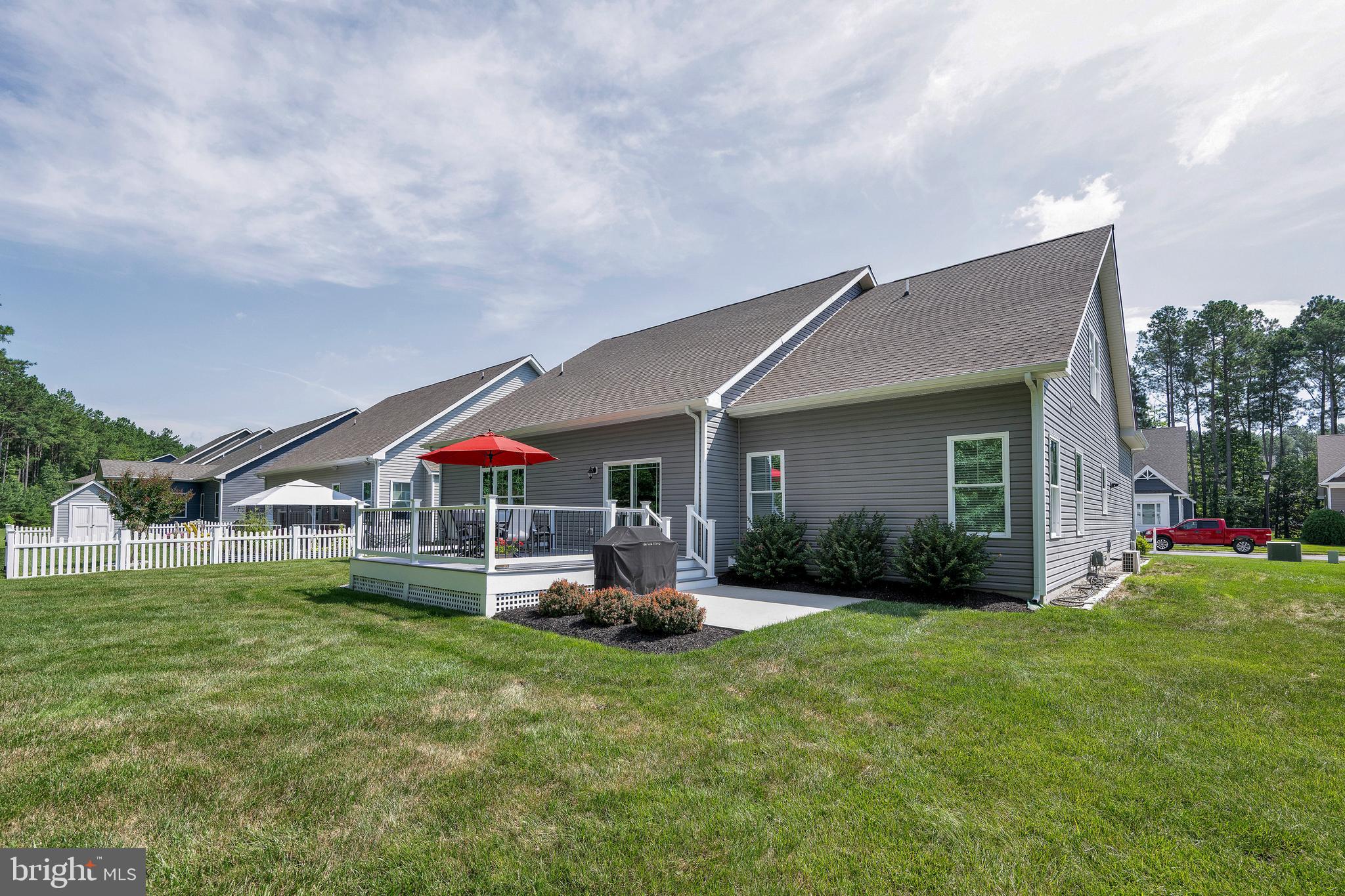 18131 Emerson Way Georgetown, DE 19947 - Photo 42 of 52 a front view of house with yard and green space