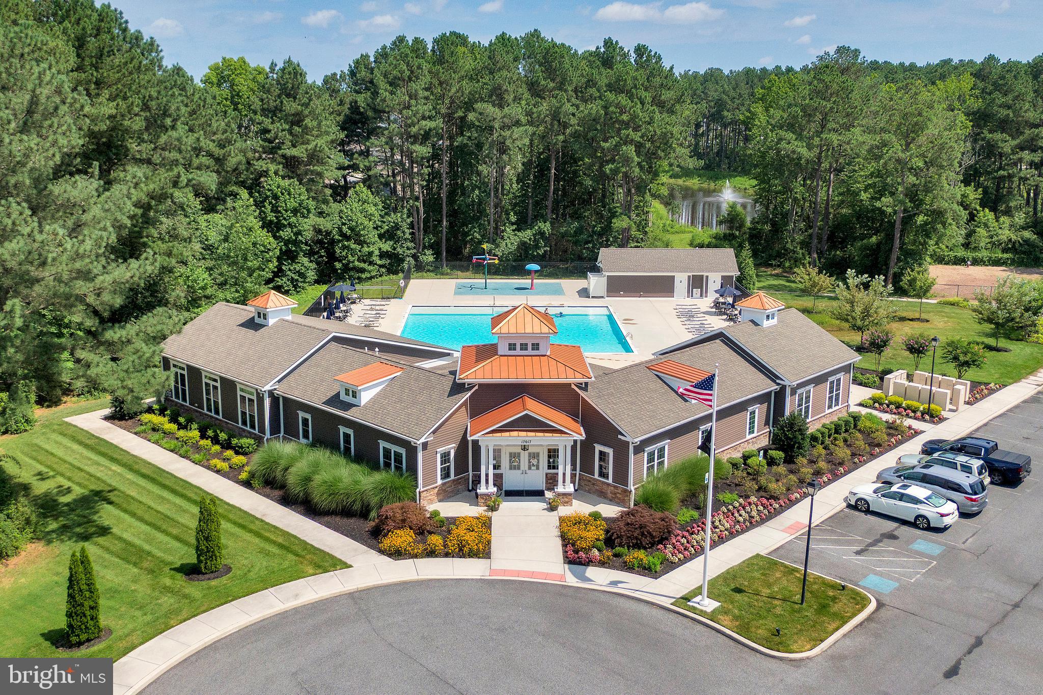 18131 Emerson Way Georgetown, DE 19947 - Photo 42 of 53 an aerial view of a house with swimming pool and garden