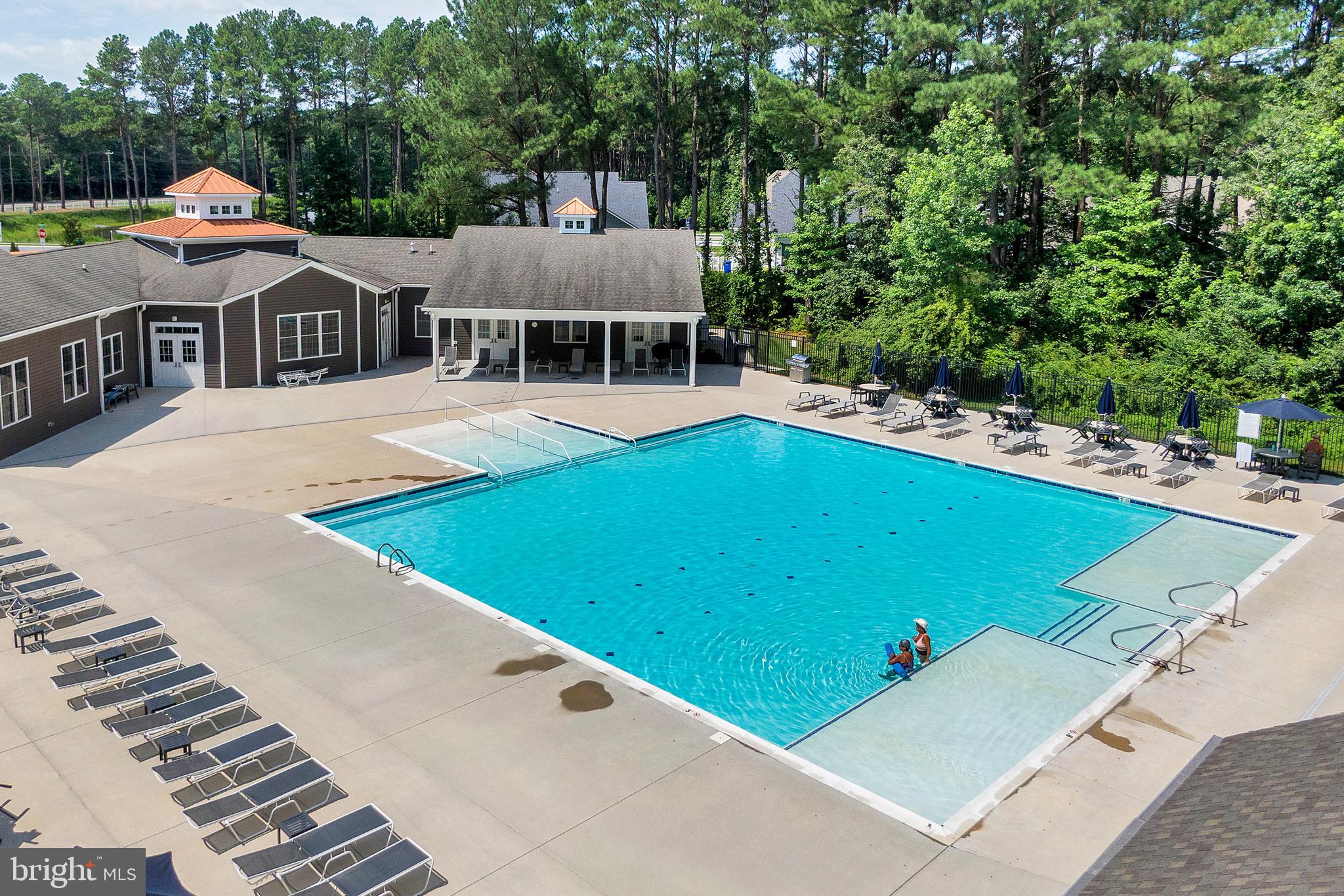 18131 Emerson Way Georgetown, DE 19947 - Photo 50 of 52 an aerial view of a house with swimming pool and deck